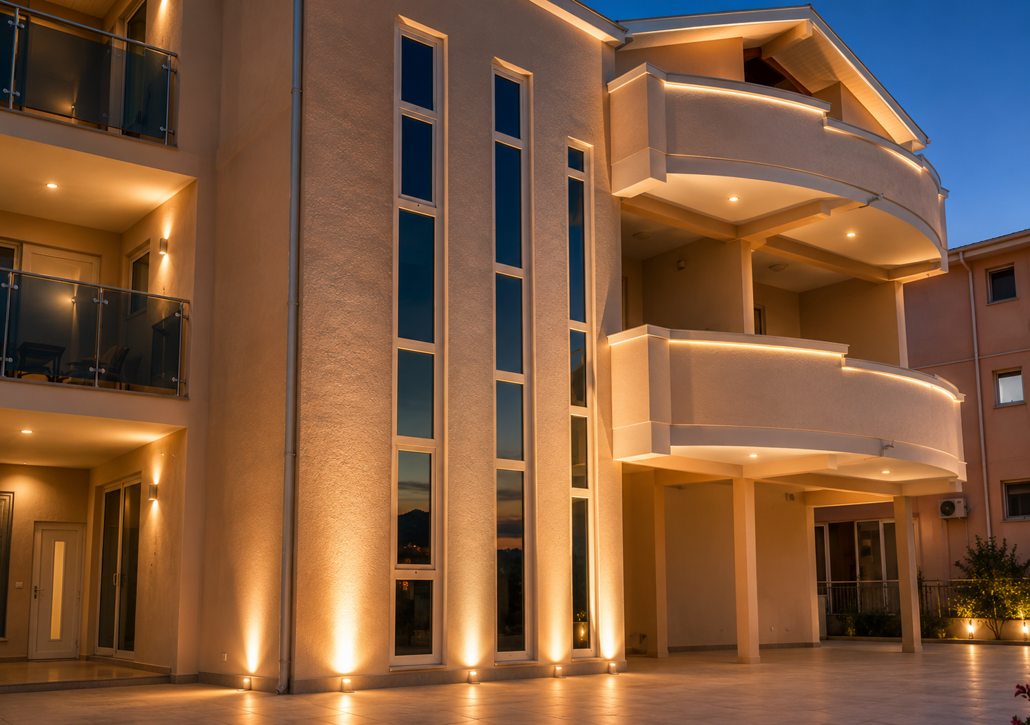 Elysium Luxury Apartments exterior at dusk